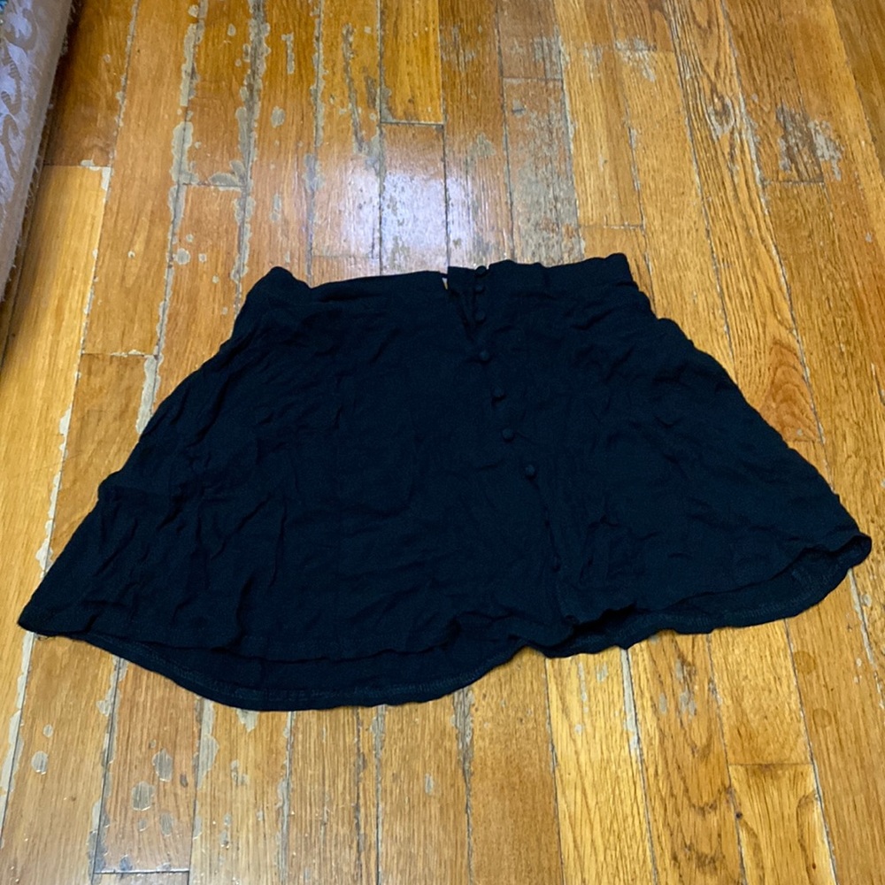 black skirt with buttons